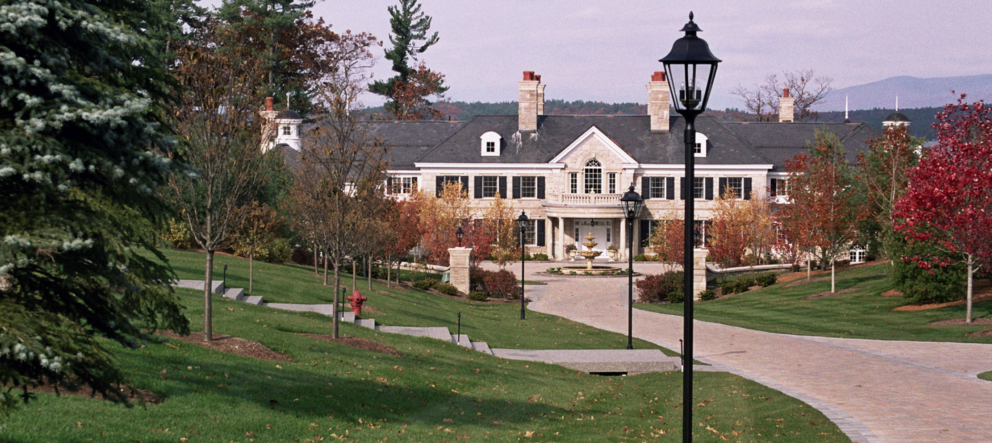 Tasker’s landscaped entrance and grounds around a New Hampshire home