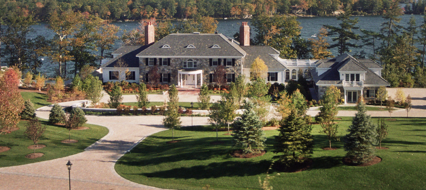Tasker’s landscaped residential grounds with lawn, stone borders and autumn trees